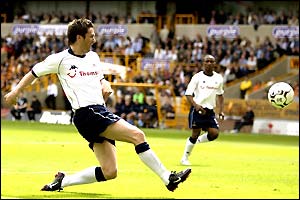 Robbie Keane scores Tottenham's first in the 2-0 win against Woves at Molineux