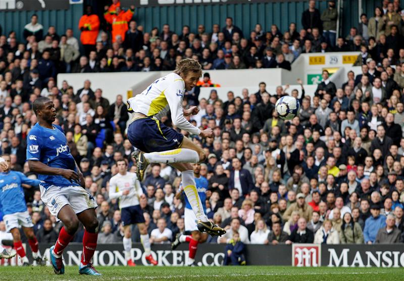 Peter Crouch converts David Bentley's cross for the opening goal for Spurs against Portsmouth