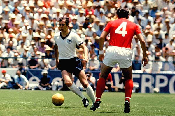 Franz Beckenbaur in action for West Hermany against England's Alan Mullery, 1970 Mexico World Cup