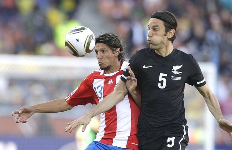 Vera of Paraguay with Vicelich of New Zealand during their 0-0 draw