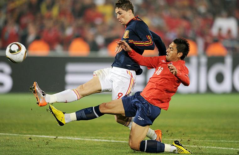 Spain's Fernando Torres with Chile's Jara