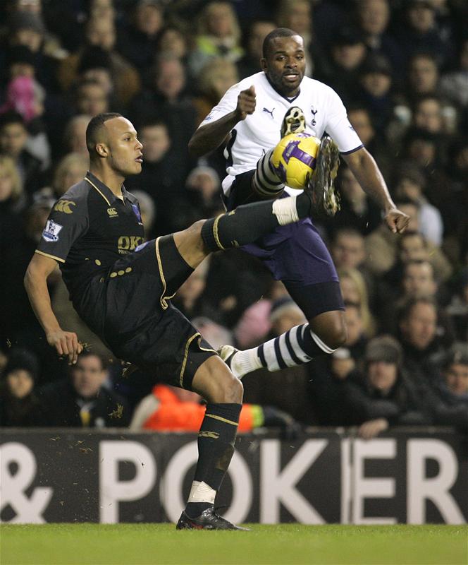 Darren Bent with Portsmouth's Younes Kaboul