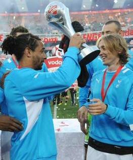 Benoit Assou-Ekotto and Luka Modric with the 2011 Vodacom Challenge trophy