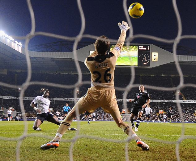 Emmanuel Adebayor scores during Tottenham 5-0 Newcastle, February 2012