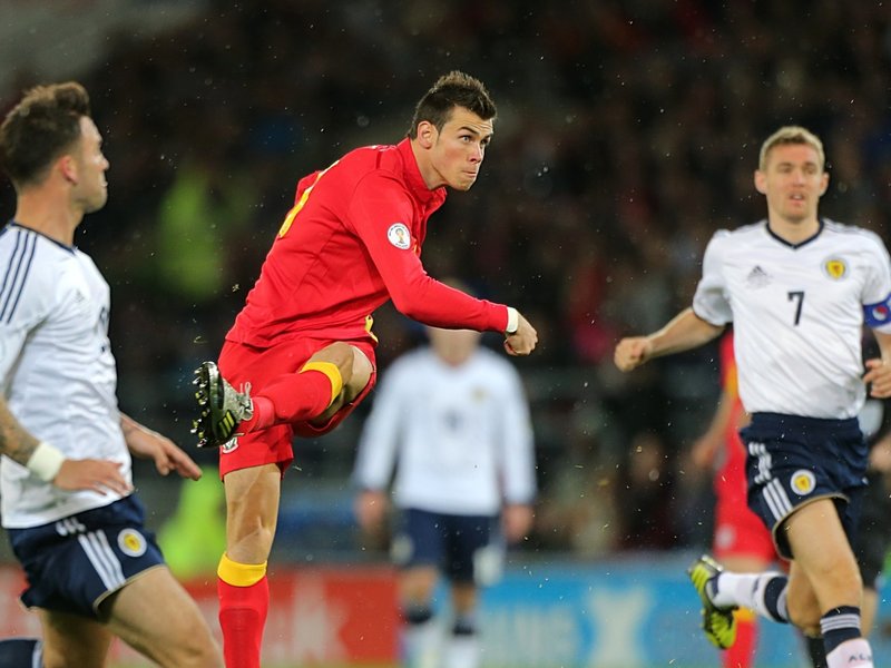 Gareth Bale scores his second goal for Wales against Scotland in the World Cup 2014 qualifier at Cardiff, October 2012